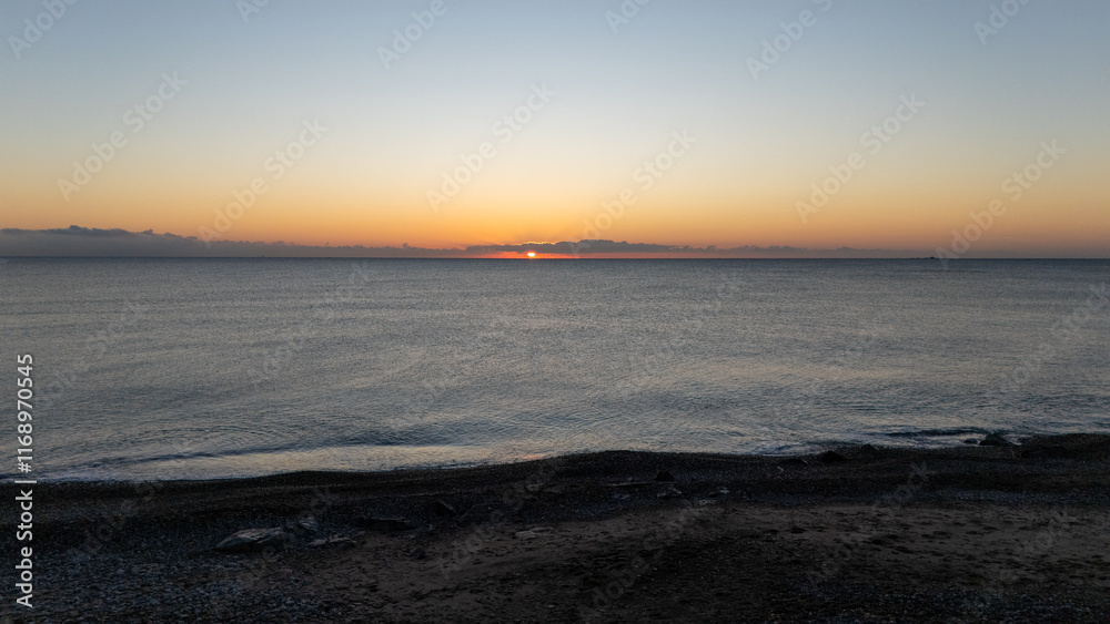 Drone aerial view of sea during sunrise Drone aerial view of sea during sunrise