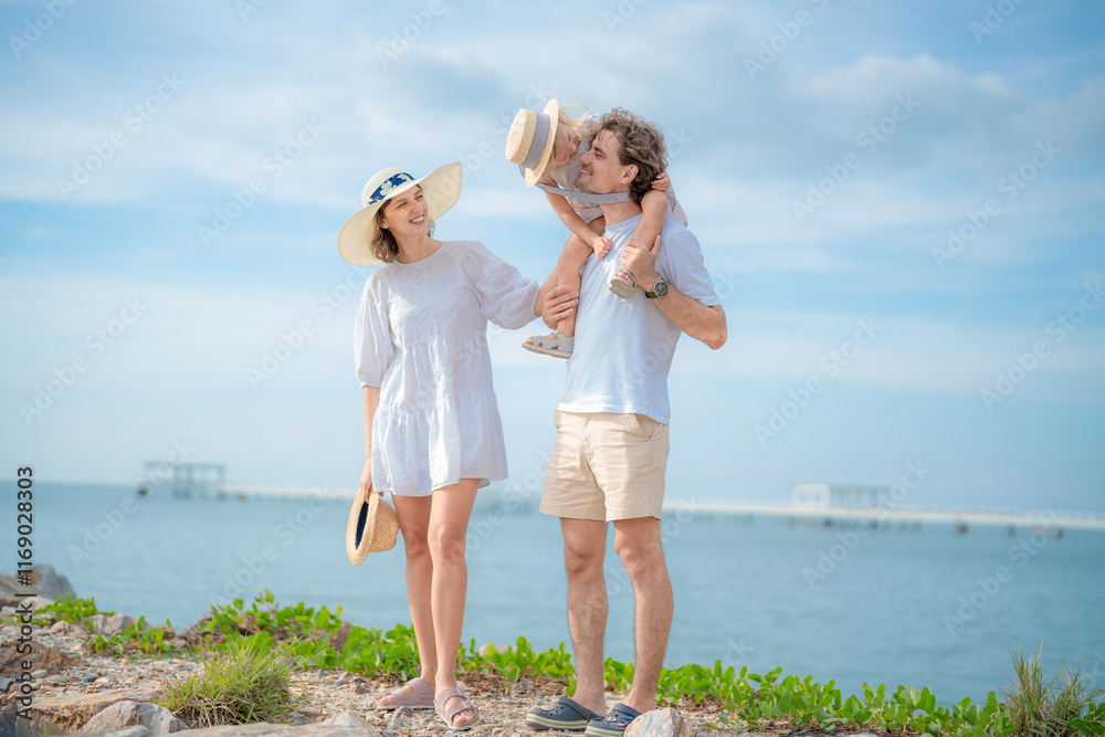 Happy family enjoying vacation on the beach together having fun on summer vacation. Happy family enjoying vacation on the beach together having fun on summer vacation.