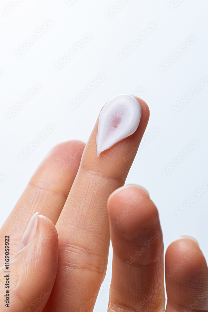 Female hand with cosmetic white cream Female hand with cosmetic white cream
