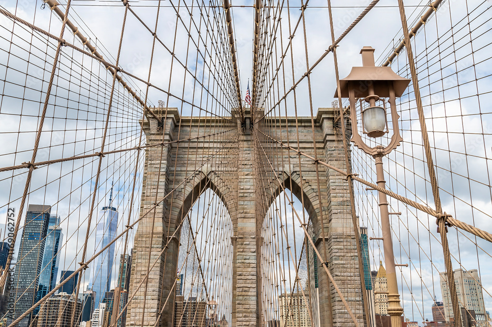 Fototapeta premium A view looking back towards the first support tower on the Brooklyn Bridge leaving Manhattan, New York, in the fall 