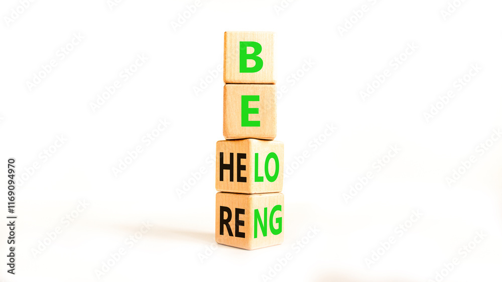 Belonging and belong symbol. Concept words Be here Belong on beautiful wooden block. Beautiful white table white background. Business motivational belonging and belong concept. Copy space. Belonging and belong symbol. Concept words Be here Belong on beautiful wooden block. Beautiful white table white background. Business motivational belonging and belong concept. Copy space.
