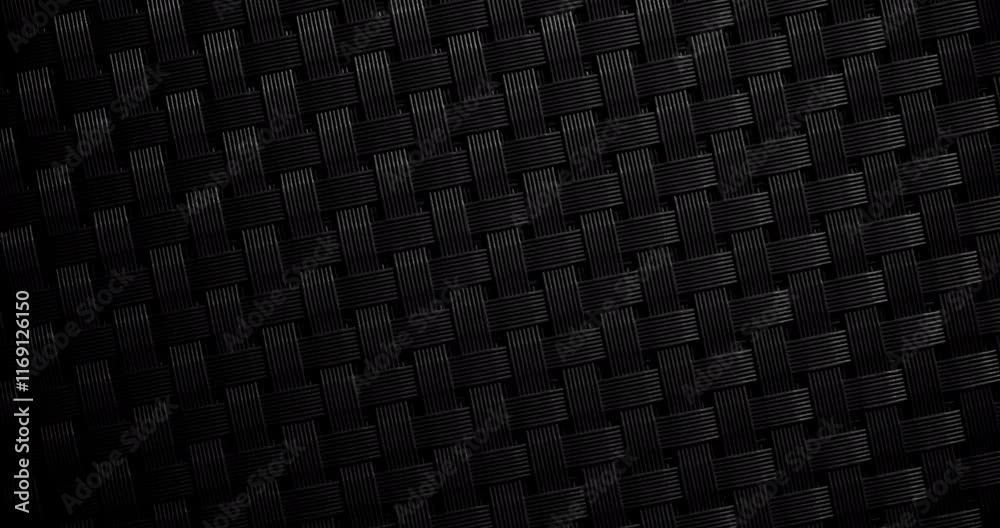 Rotating Seamless Black Woven Carbon Texture with Slow Camera Motion. A seamless loop of a black woven carbon fiber texture captured in slow, smooth camera motion.