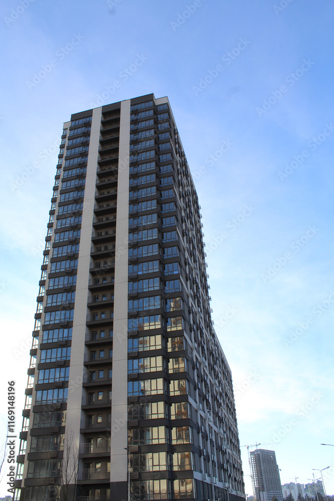 modern high-rise building under construction in a new residential complex, modern architecture in the city, facades of new buildings modern high-rise building under construction in a new residential complex, modern architecture in the city, facades of new buildings