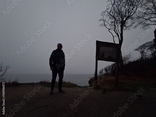 dunkle Silhouette einer Person im mystischen Geisterwald in Nienhagen (Mecklenburg - Vorpommern) bei Nacht photo