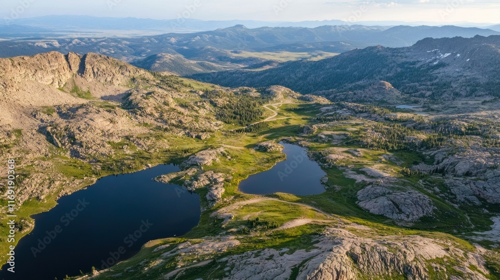 An aerial view of the Mount Evans Scenic Byway in summer, with sharp hairpin turns and panoramic vistas of Colorado rugged landscape An aerial view of the Mount Evans Scenic Byway in summer, with sharp hairpin turns and panoramic vistas of Colorado rugged landscape