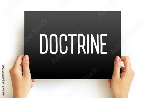 Doctrine - body of teachings or instructions, taught principles or positions, as the essence of teachings in a belief system, text concept on card photo