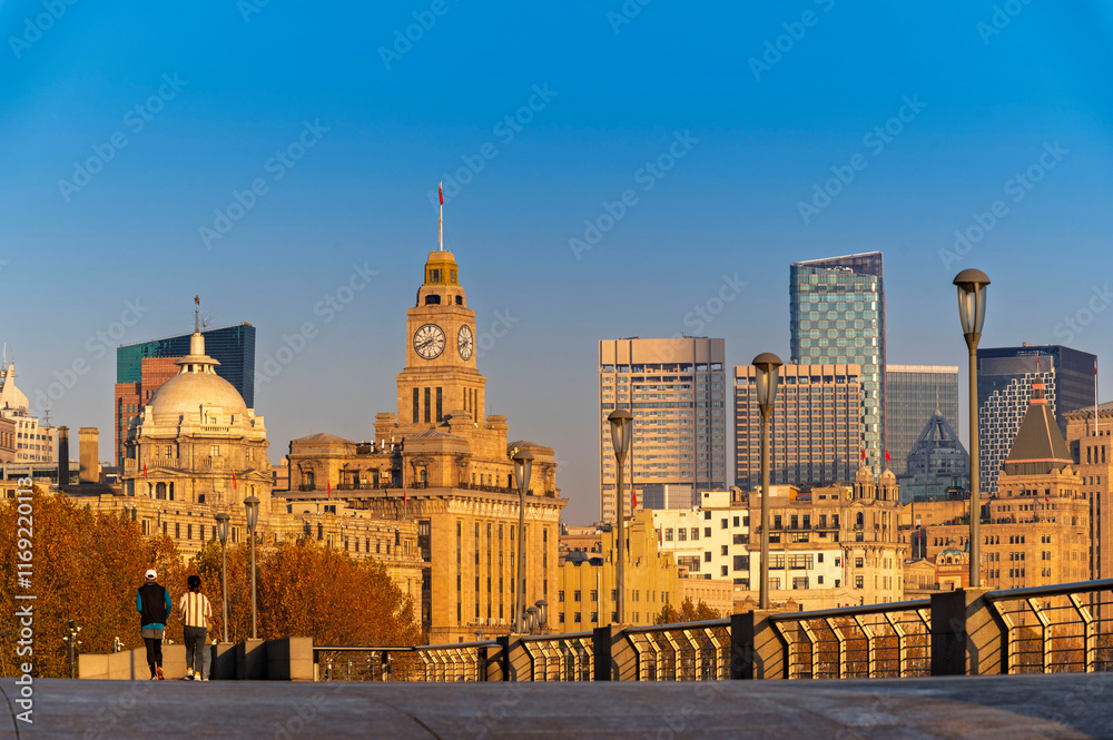 Morning sunrise of Historical architecture on the bund of Shanghai with reflection of buildings in city Shanghai, China