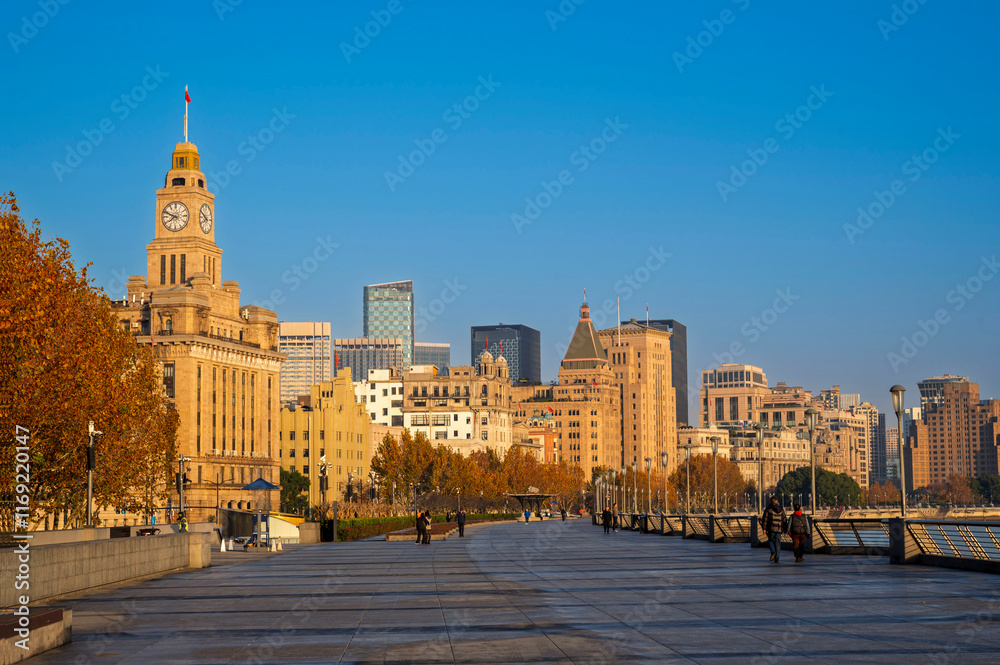 Morning sunrise of Historical architecture on the bund of Shanghai with reflection of buildings in city Shanghai, China