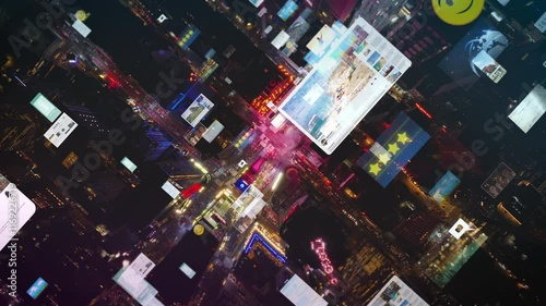 Aerial views of Times Square capture nighttime atmosphere, featuring digital overlays of data and social media icons, blend of technology and urban life in New York City