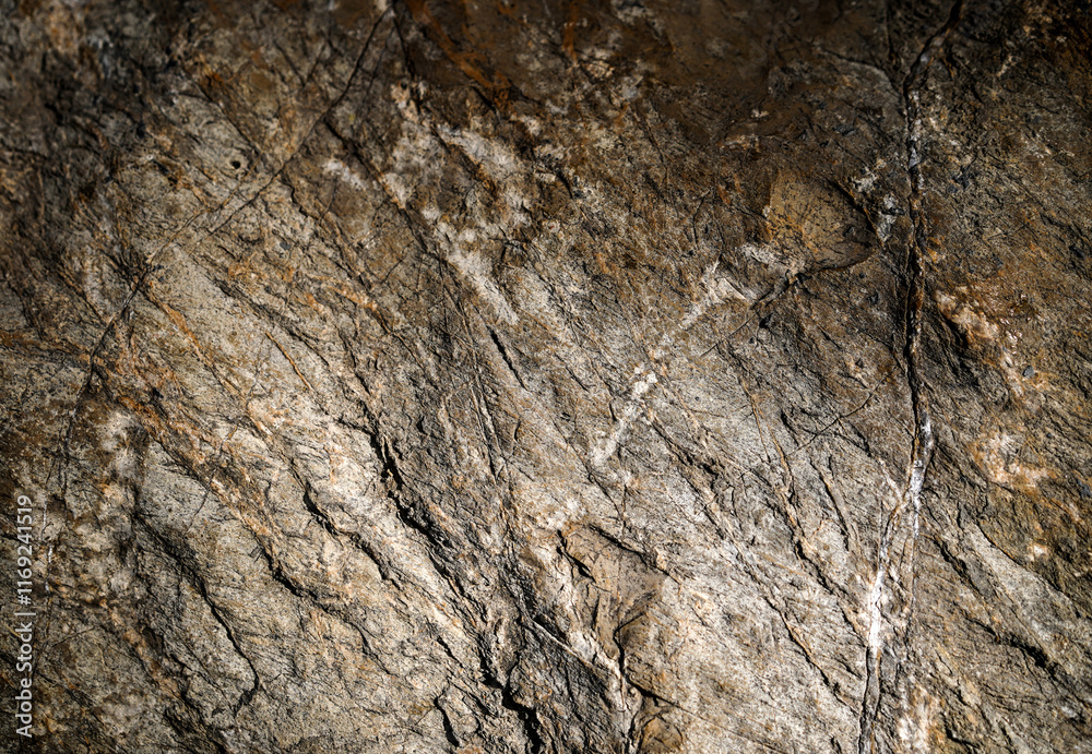 Empty rough brown natural stone wall on cave with rust color for abstract background and texture. beautiful patterns, space for work, banner, seamless wallpaper close up. Empty rough brown natural stone wall on cave with rust color for abstract background and texture. beautiful patterns, space for work, banner, seamless wallpaper close up.
