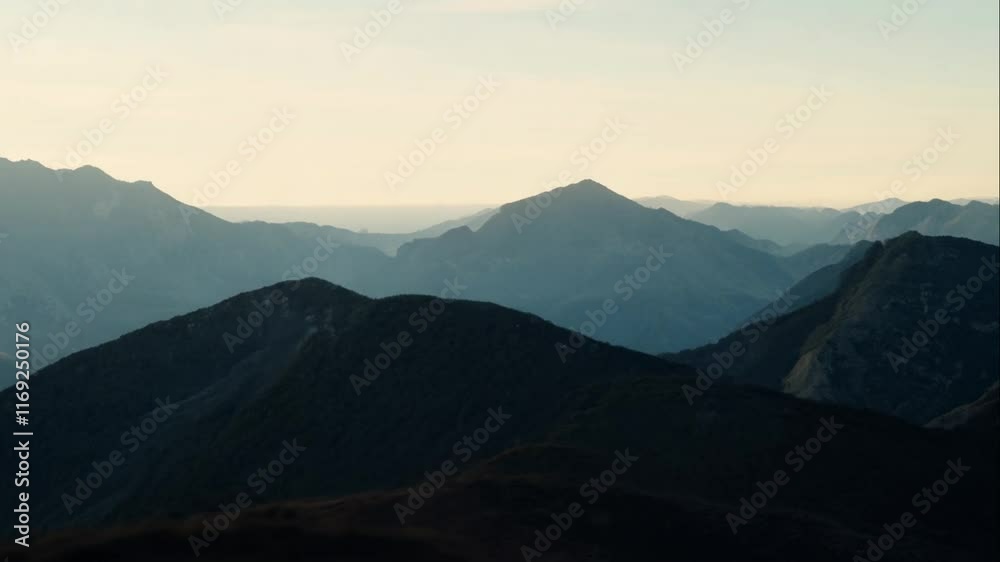 Serene Mountain Landscape at Sunrise with Soft Hues Illuminating Majestic Peaks and Tranquil Valleys Enhancing Nature's Beauty in a Scenic View Serene Mountain Landscape at Sunrise with Soft Hues Illuminating Majestic Peaks and Tranquil Valleys Enhancing Nature's Beauty in a Scenic View