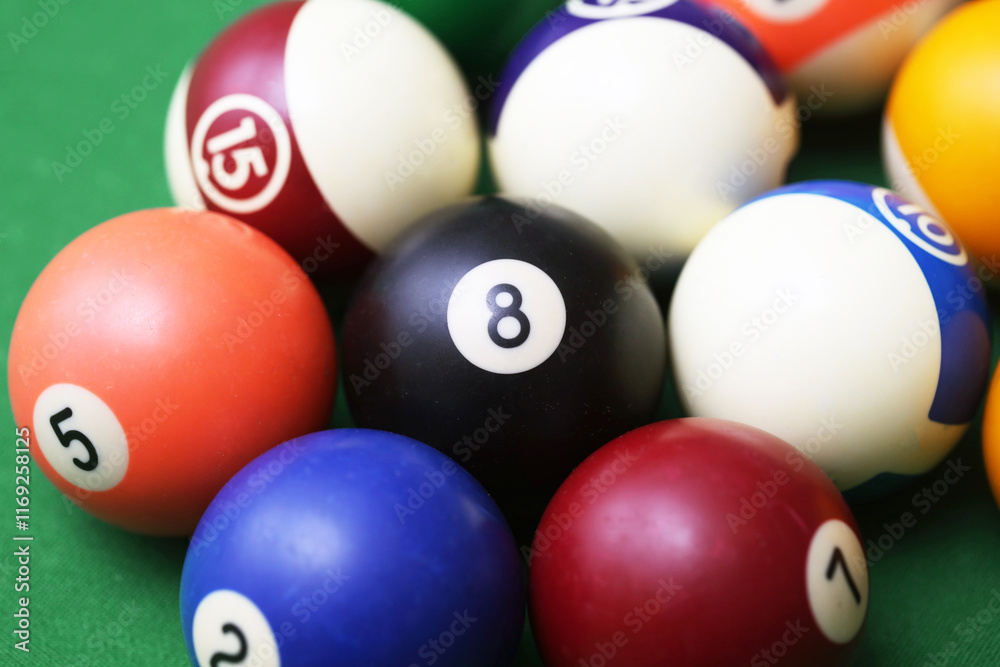 Pool ball game on a green billiard table. Playing snooker and billiards with cue. Number 8 ball in middleNumbered ball background. Fun sports environment. Entertainment backdrop Pool ball game on a green billiard table. Playing snooker and billiards with cue. Number 8 ball in middleNumbered ball background. Fun sports environment. Entertainment backdrop