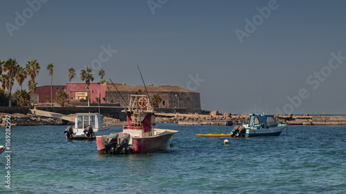 Obraz na płótnie Port of isle de goree, a former slave port on the named island, just outside of Dakar in Senegal. Visible sea, bay and port, now a tourist spot. w salonie