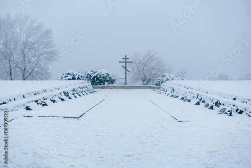 Photography Slavin Second Word War  memorial monument and military cemetery in snowy, foggy