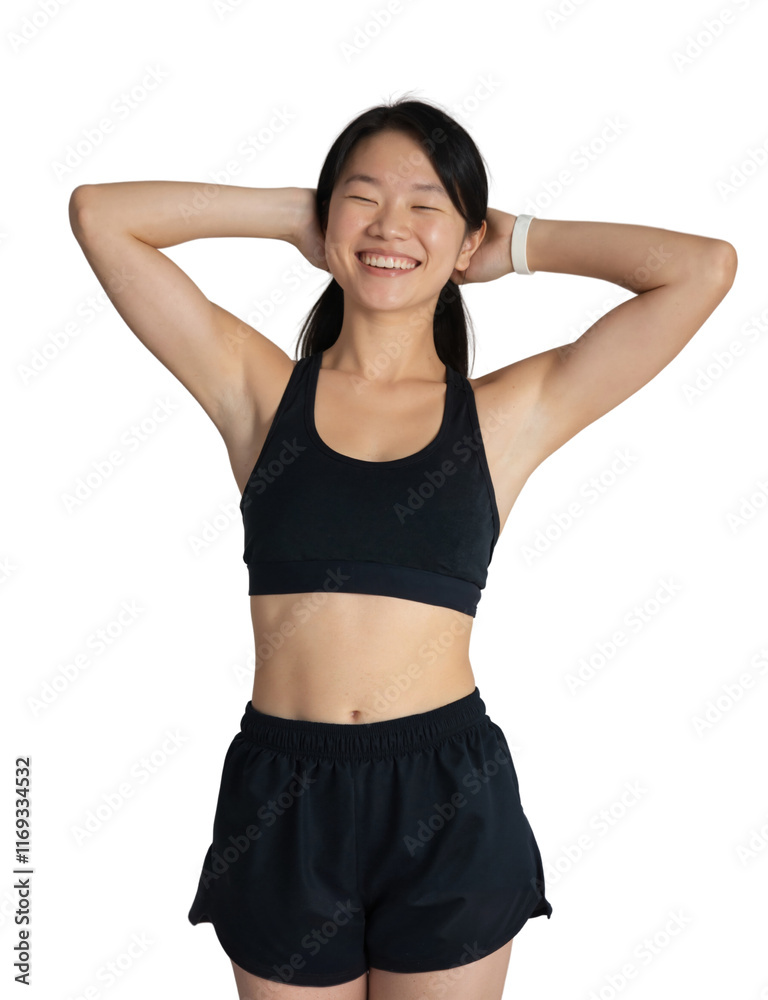 Asian woman with long black hair, wearing a black sports bra and shorts, standing against a white wall. Asian woman with long black hair, wearing a black sports bra and shorts, standing against a white wall.