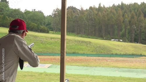 Clay pigeon shooter breaking a clay pigeon - 117