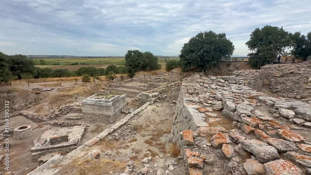 Ancient ruins of Troy under a cloudy blue sky Ancient ruins of Troy under a cloudy blue sky