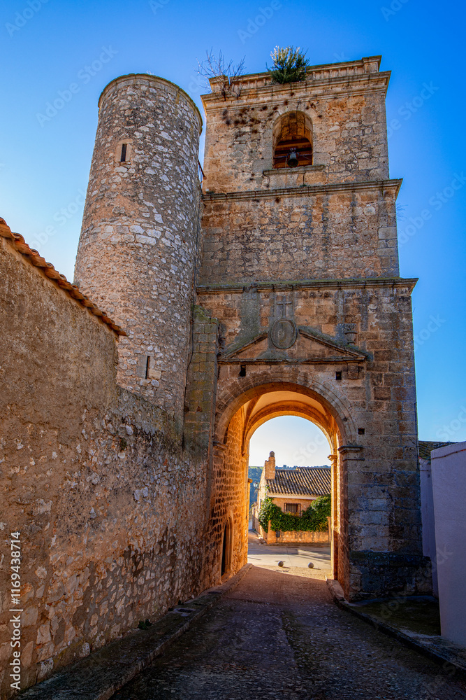 Naklejka premium Bell tower of the Santísima Trinidad church in Alarcon, Cuenca, Castilla-La Mancha, Spain with daylight