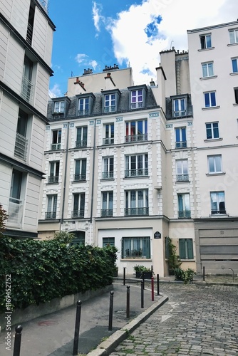 Charming Parisian Residential Building with Cobblestone Path and Ivy