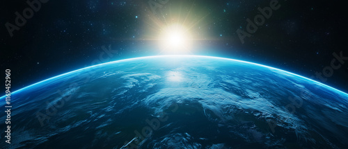 Fototapeta Naklejka Na Ścianę i Meble -  Stunning view of Earth from space with sun rising over horizon, showcasing planet curvature and glowing atmosphere in cosmic setting