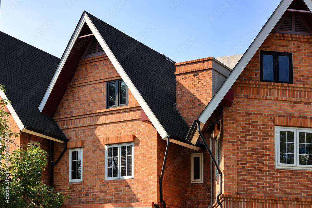 Building made of brick facade with beautiful white wooden windows. Building made of brick facade with beautiful white wooden windows.