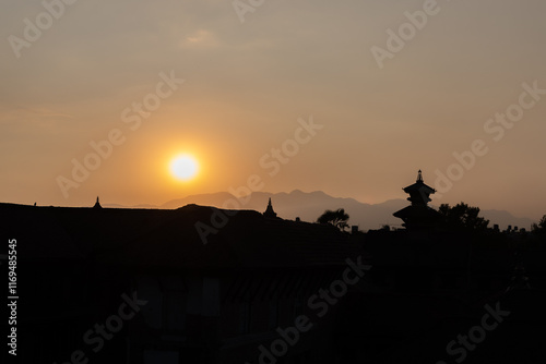 Nepal- Bhaktapur im Gegenlicht: Sonnenuntergang mit  Skyline mit Pagoden photo