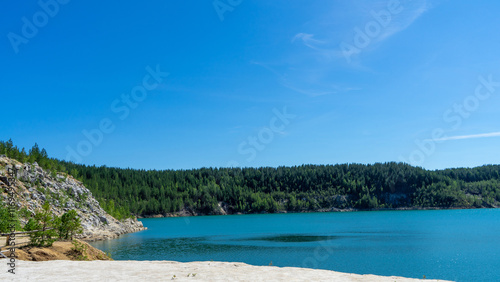 Abandoned Lipovsky nickel quarry near of city Rezh, Sverdlovsk region, the Urals with turquoise water in Lipovskiy Geological Park. Natural and mineralogical reserve Rezhevskoy