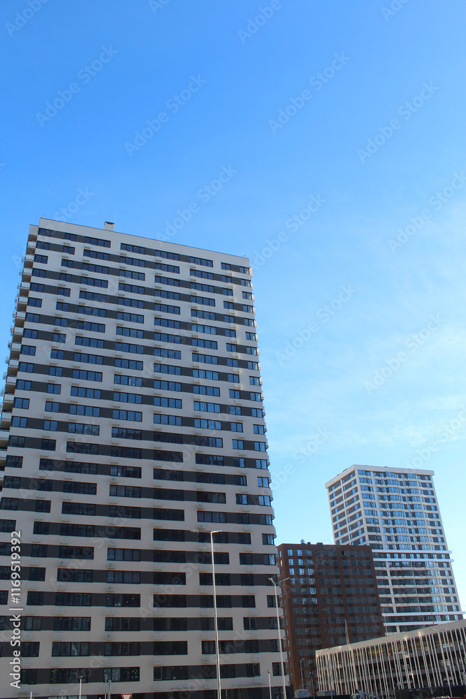 new apartment building in city, facade of new buildings,modern office building with sky new apartment building in city, facade of new buildings,modern office building with sky