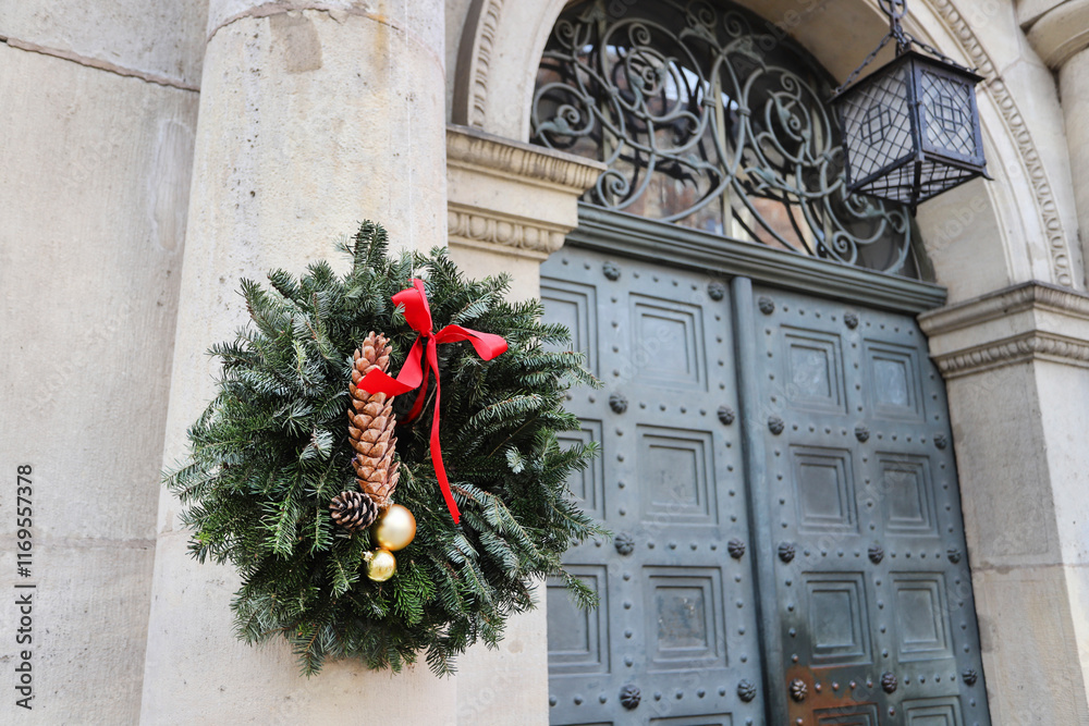 Beautiful Christmas wreath by the entrance to the tenement.