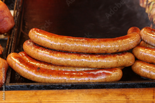 Obraz na płótnie Grilled sausages ready to eat. w salonie
