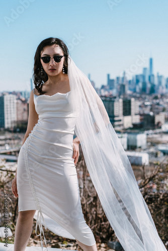 Stylish Model Dressed Elegantly Poses Against a Beautiful City Skyline Backdrop
