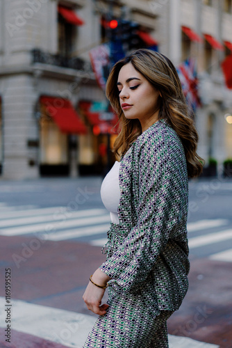 Woman walking in urban city street wearing stylish checkered suit