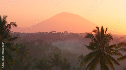 Beautiful sunrise scenery in Bali covered with mountains and mist aerial drone shot, Indonesia
