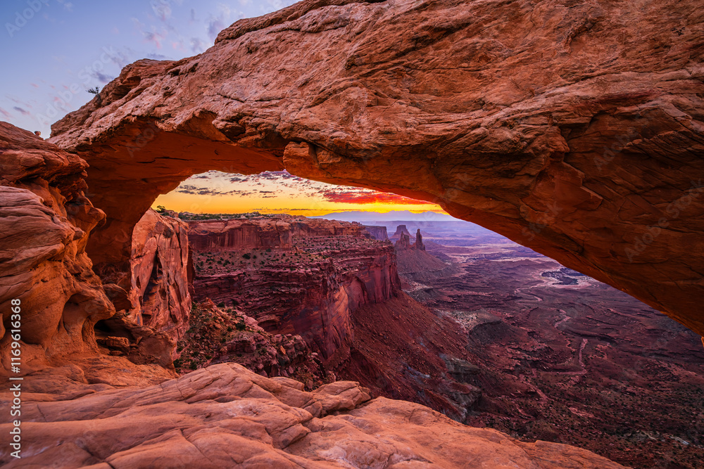A colorful morning sunrise at the Mesa Arch in the Island in the Sky district of the Canyonlands National Park near Moab in Utah United States.