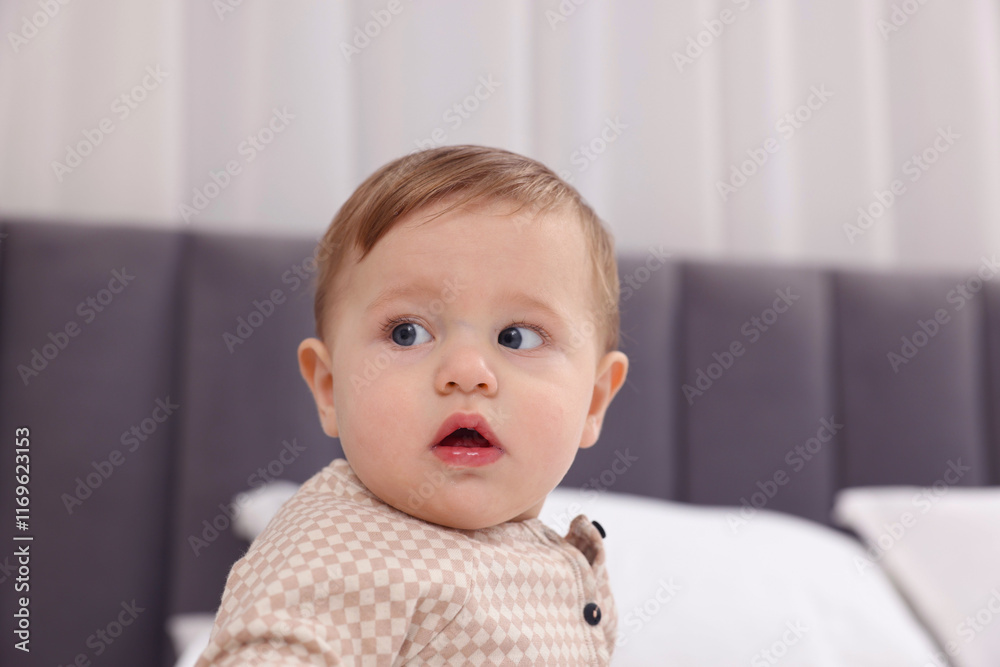 Cute little baby on bed at home Cute little baby on bed at home