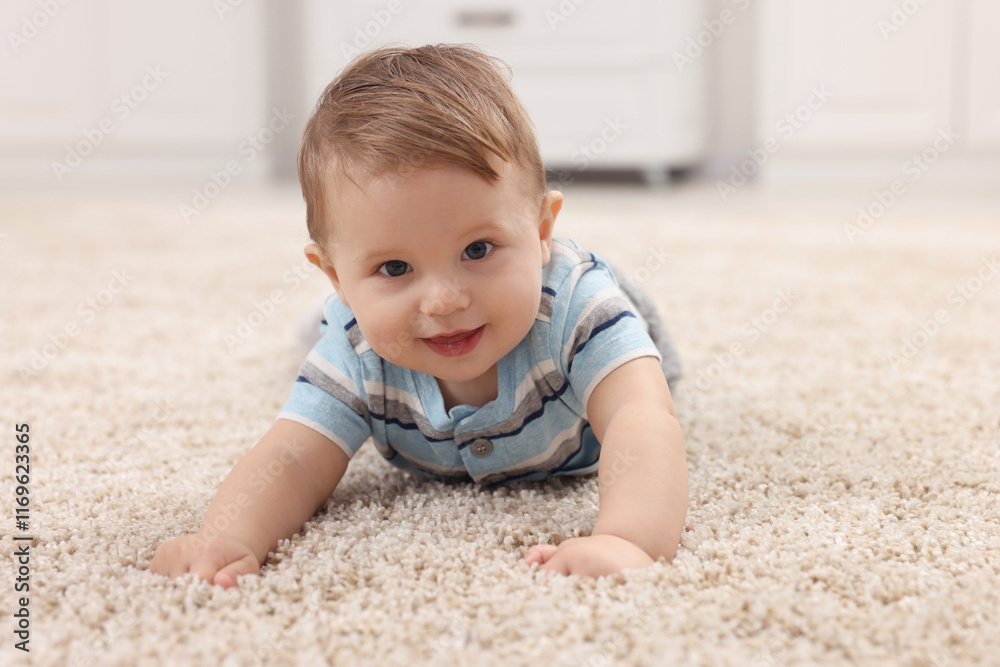 Adorable baby boy on floor at home Adorable baby boy on floor at home