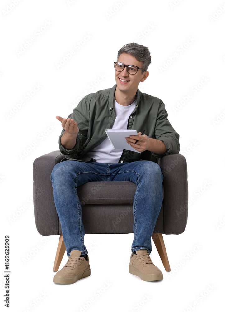 Professional psychologist with notebook sitting on chair against white background
