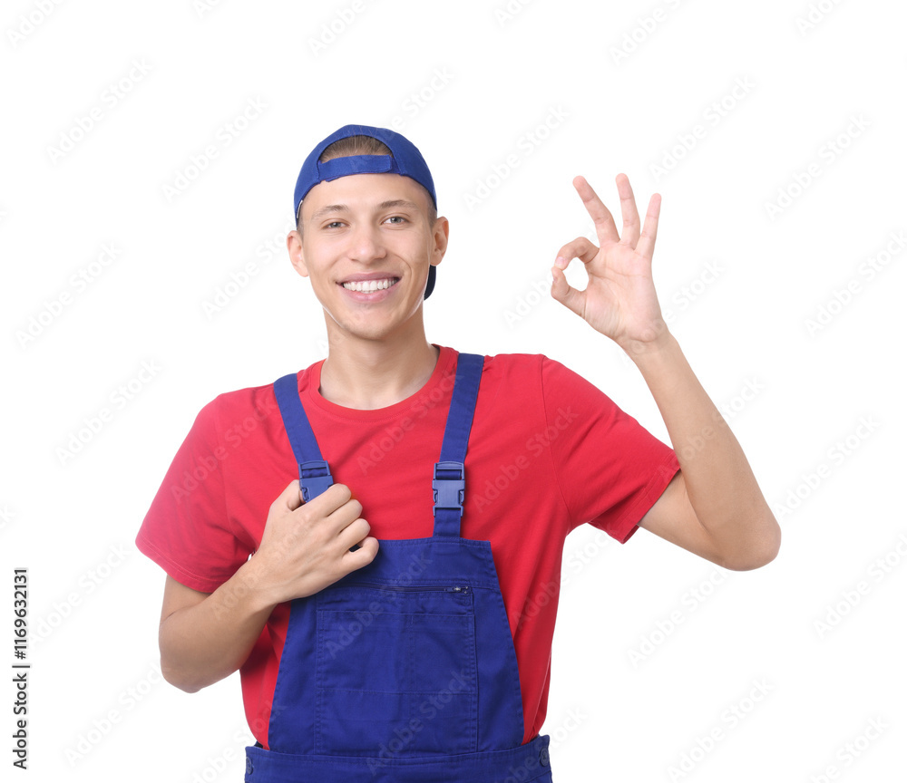 Happy young man in uniform showing OK gesture on white background Happy young man in uniform showing OK gesture on white background