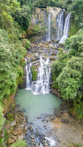 Vertical aerial view of Nauyacas Waterfalls of Baru River in the middle of the green tropical forest in Costa Rica photo