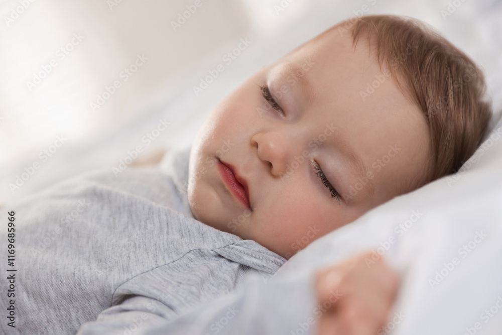 Cute little baby sleeping on bed at home, closeup Cute little baby sleeping on bed at home, closeup