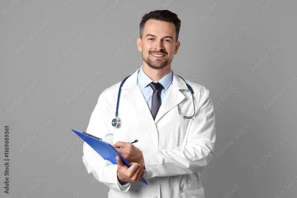 Smiling doctor with stethoscope and clipboard on grey background Smiling doctor with stethoscope and clipboard on grey background