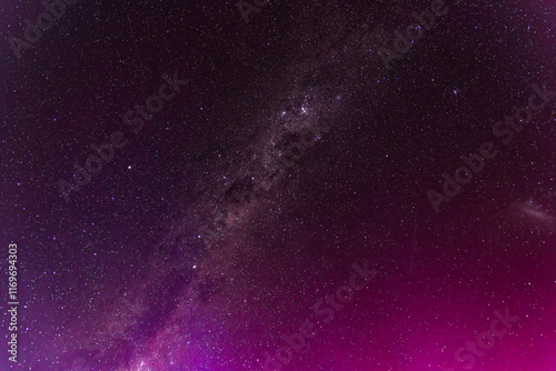 Aurora Australis lights up the Milky Way predawn sky in pinks photo