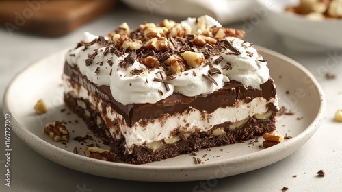 Wallpaper Mural A decadent layered chocolate dessert topped with whipped cream, crunchy nuts, and delicate chocolate shavings, offering a rich and indulgent treat. Torontodigital.ca