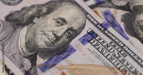 the president for American money with a face value of one hundred dollars, details of new American dollar banknotes for one hundred dollars in close-up