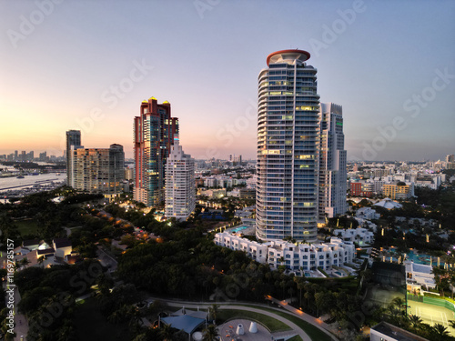 Miami South beach at night. Aerial view on skyscraper cityscape at night. Night city aerial view. Luxury skyscraper in Miami. Illuminated Florida. City skyline in evening sundown. Aerial cityscape photo