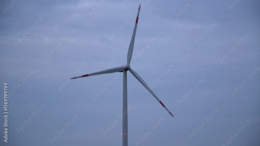 Wind Turbine Silhouetted Against A Breathtaking Evening Sky, Emphasizing Sustainable Energy Solutions, Showcasing Modern Technology In Harmony With Nature, And Inspiring Eco-Friendly Progress. Wind Turbine Silhouetted Against A Breathtaking Evening Sky, Emphasizing Sustainable Energy Solutions, Showcasing Modern Technology In Harmony With Nature, And Inspiring Eco-Friendly Progress.