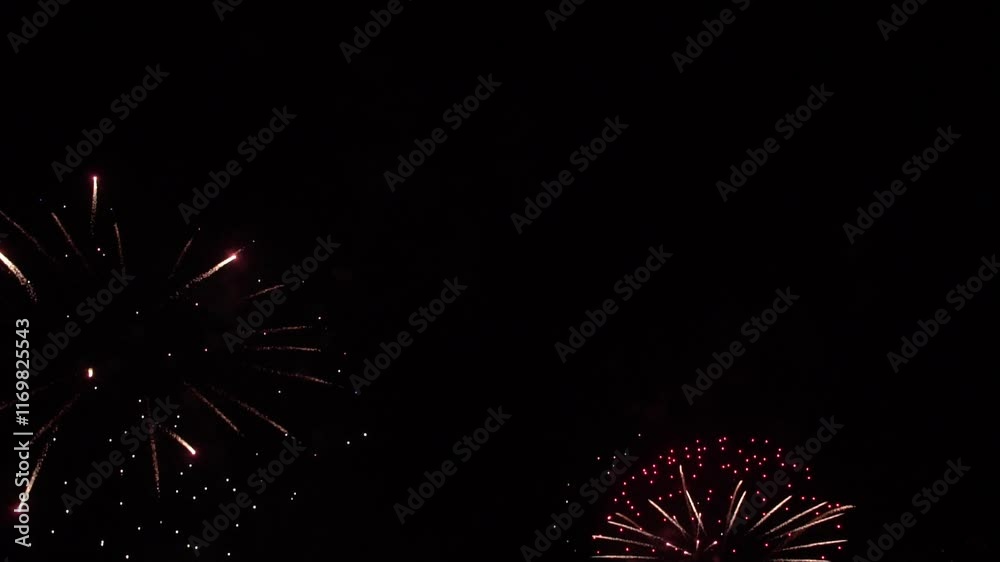 Real Shining Fireworks Display New year's Celebration in Night Sky. Slow motion. Real Shining Fireworks Display New year's Celebration in Night Sky. Slow motion.