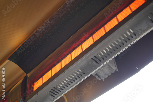 Modern electric infrared heater on celling 