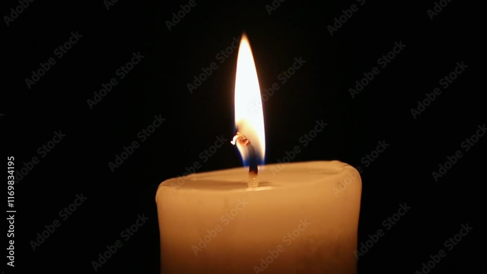 Close-up single candle beautiful burning on dark black background, candle fire flame light with empty space isolated. Ritual with romantic candle wax fire Close-up single candle beautiful burning on dark black background, candle fire flame light with empty space isolated. Ritual with romantic candle wax fire