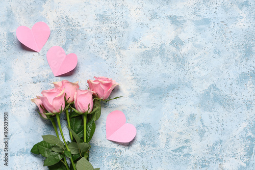 Fototapeta Naklejka Na Ścianę i Meble -  Pink roses with paper hearts on grunge background. Valentine's Day celebration